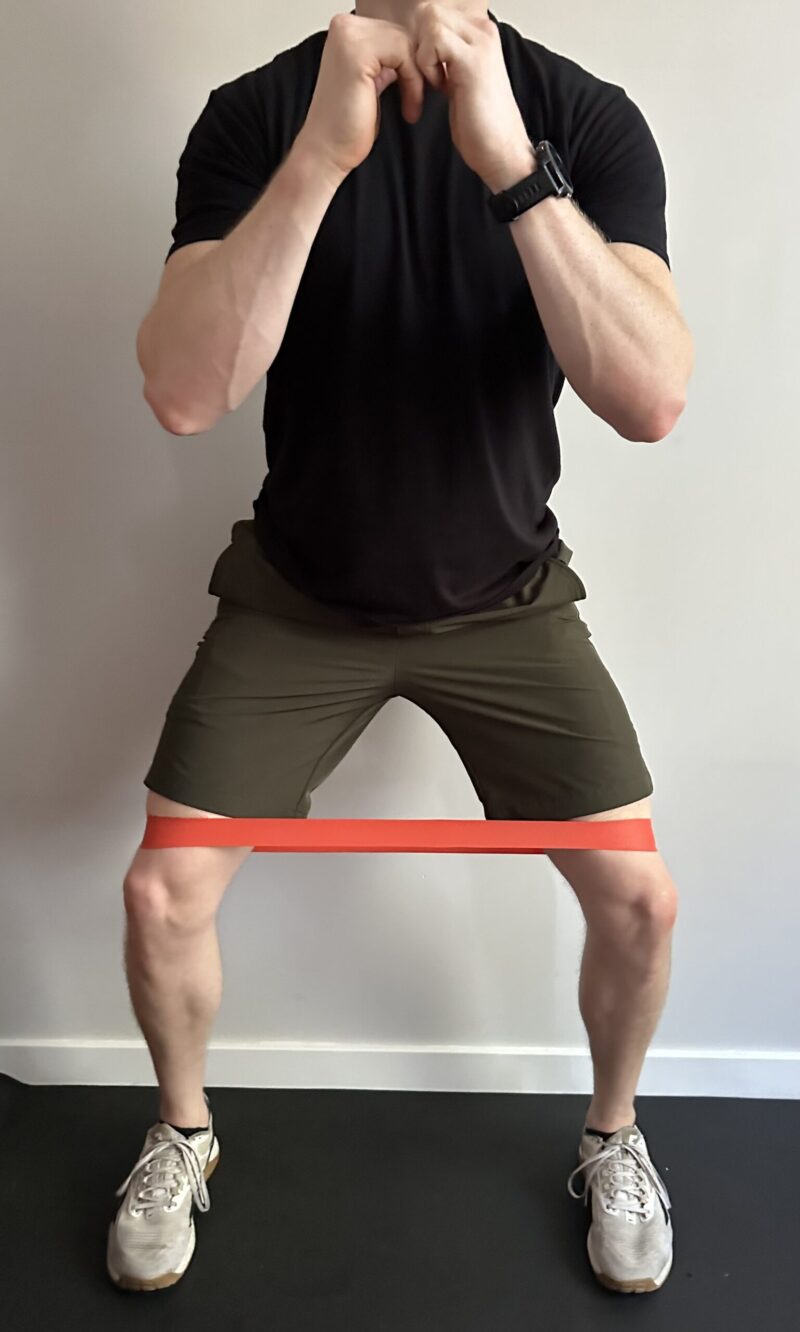 Demonstration of sidesteps with a resistance band exercise