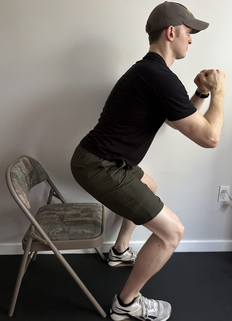 Demonstration of a squat to a chair exercise for strengthening all of the muscles in the lower extremities for physical therapy rehabilitation