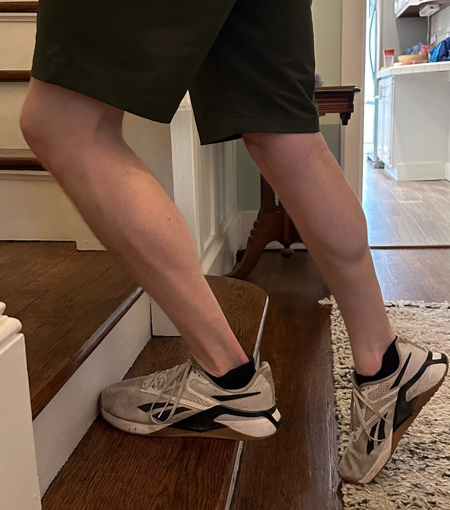 I am demonstrating a step-up exercise to work on lower extremity strengthening for physical therapy rehabilitation