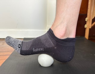 I'm performing a lacrosse ball mobilization to my plantar fascia