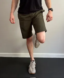 Demonstrating a single leg stance to work on balance and proprioception for the knee joint.