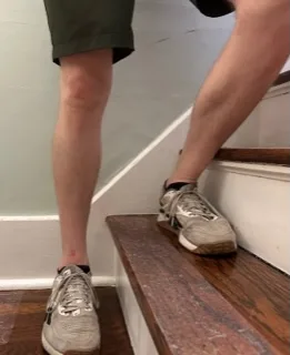 I'm demonstrating a lateral step-up to strengthen the muscles surrounding the knee joint for physical therapy rehabilitation