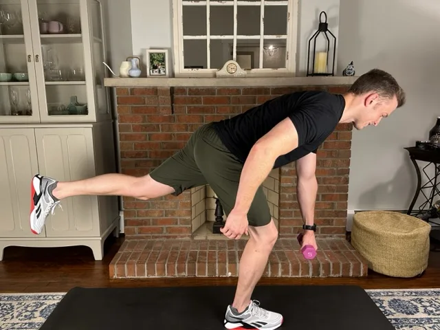 demonstrating single leg romanian dead lift to help treat patellofemoral pain syndrome