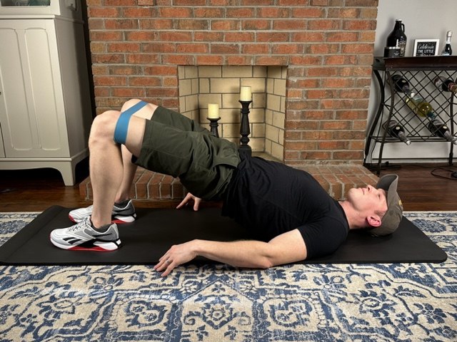 Demonstrating a bridge exercise to strengthen the butt and hip muscles for the treatment of gluteal tendinopathy