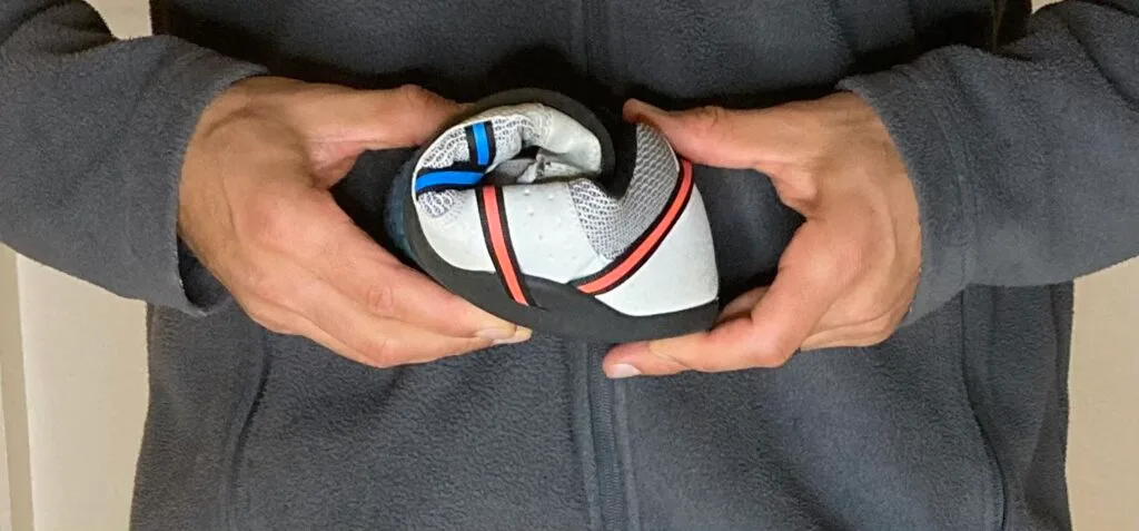 demonstrating the flexible and bunion friendly sole of a minimalist shoe
