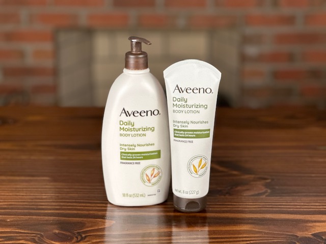 bottles of Aveeno lotion to perform scar massage