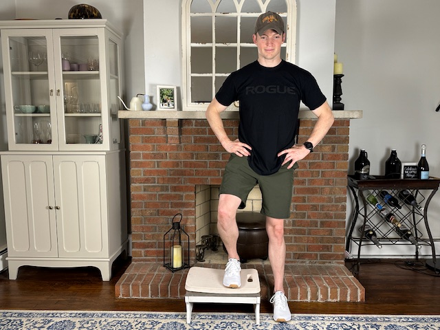 Demonstrating the lateral step-up exercise to increase lower extremity strength after a knee meniscus repair